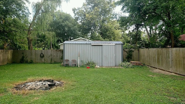 view of outbuilding featuring a yard