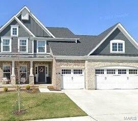 craftsman inspired home with a front yard