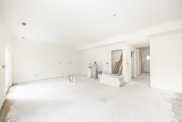 unfurnished room with concrete flooring