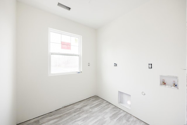 clothes washing area featuring washer hookup, laundry area, hookup for a gas dryer, and light wood-style flooring