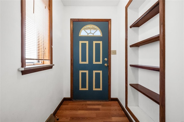 doorway featuring dark wood-type flooring