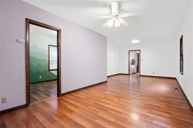 empty room featuring light wood-type flooring and ceiling fan