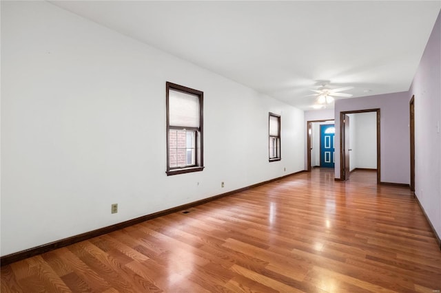 spare room featuring ceiling fan and wood-type flooring