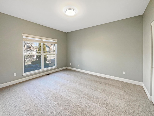 unfurnished room featuring carpet floors