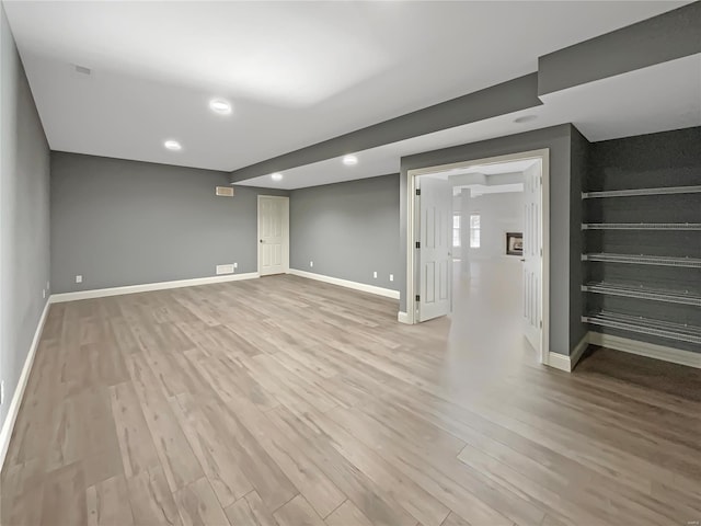 basement featuring light hardwood / wood-style flooring