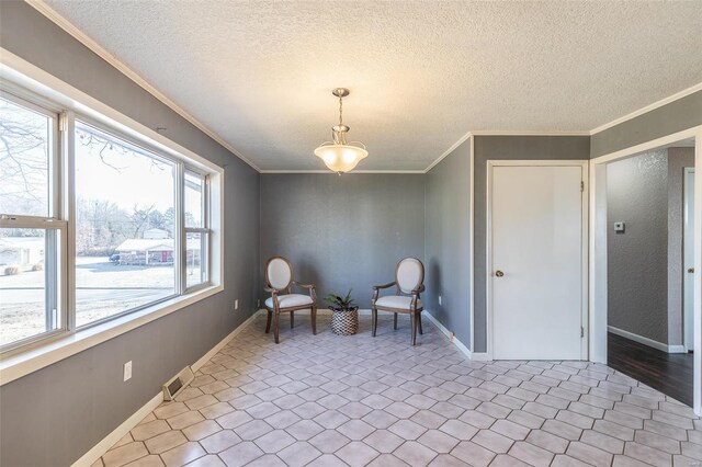 living area featuring ornamental molding, visible vents, a textured ceiling, and baseboards