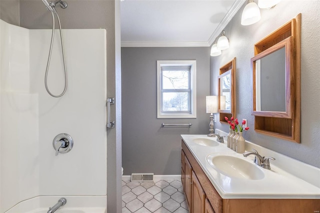 bathroom with ornamental molding,  shower combination, visible vents, and a sink