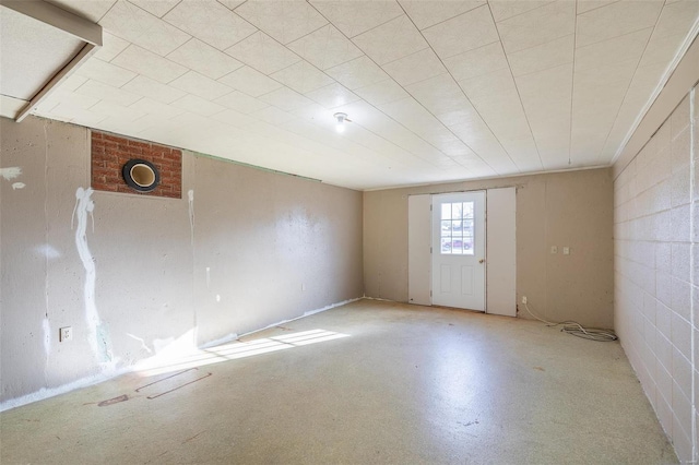 unfurnished room with concrete floors