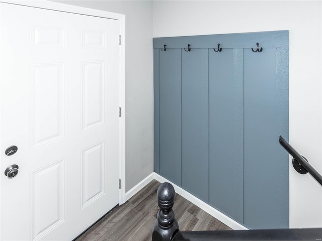 mudroom with wood finished floors and baseboards