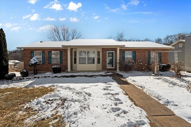 ranch-style house with brick siding