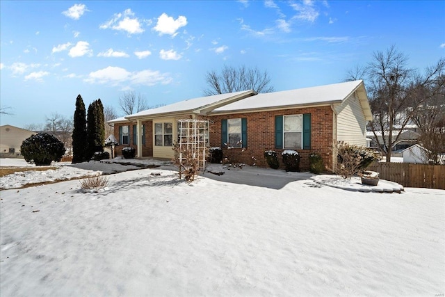 single story home with brick siding