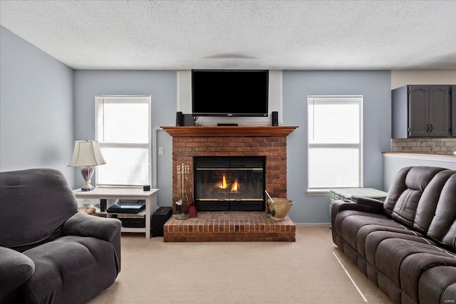 living area with a brick fireplace, light colored carpet, a textured ceiling, and baseboards