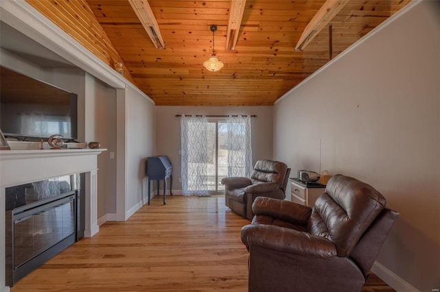 living room featuring light hardwood / wood-style flooring, a high end fireplace, wooden ceiling, and lofted ceiling with beams