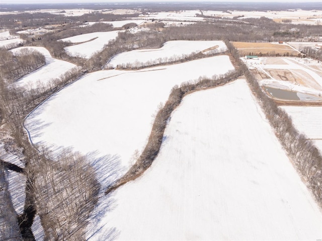 snowy aerial view with a rural view