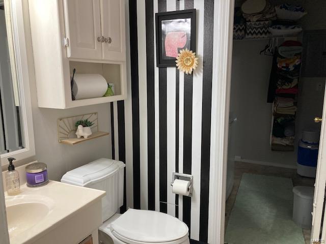 bathroom with vanity and toilet