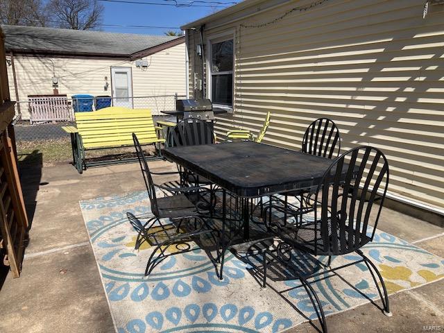 view of patio with outdoor dining space and grilling area