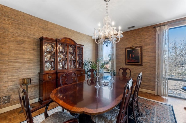 dining space with visible vents, a healthy amount of sunlight, and baseboards