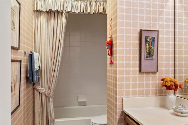 full bath featuring wallpapered walls, toilet, shower / bath combination, and vanity