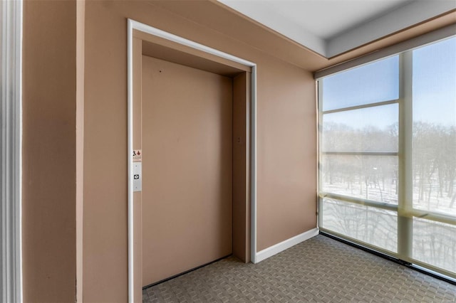 unfurnished sunroom with elevator