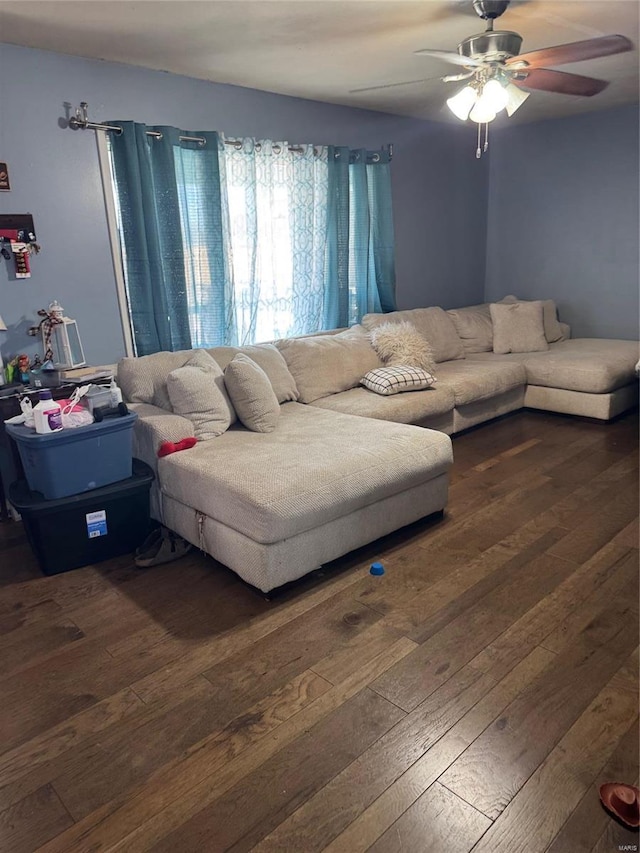 living room with ceiling fan and dark hardwood / wood-style floors