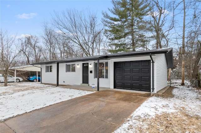 ranch-style home featuring a carport and a garage