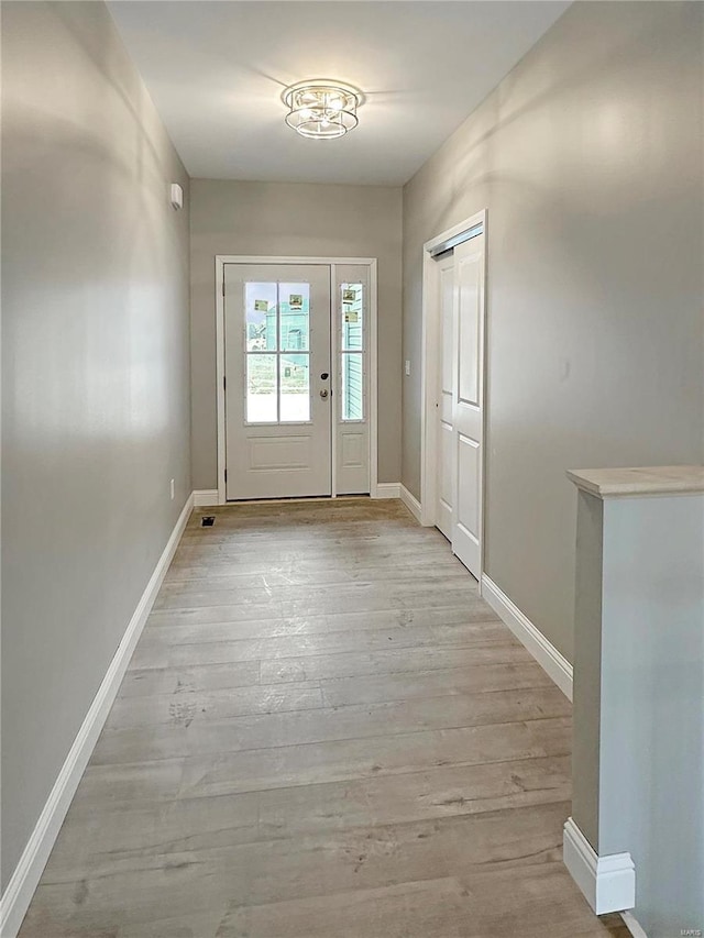 doorway to outside featuring light hardwood / wood-style flooring