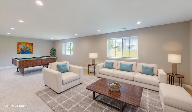 living room featuring billiards and light colored carpet