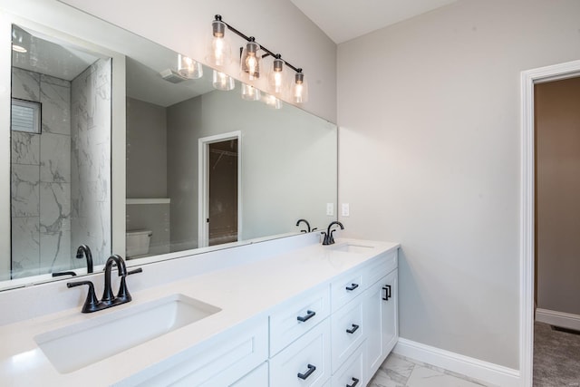 bathroom with toilet and vanity