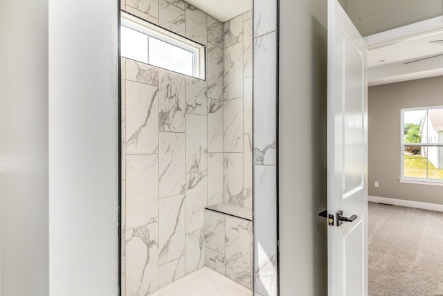 bathroom featuring tiled shower