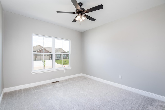 carpeted empty room with ceiling fan