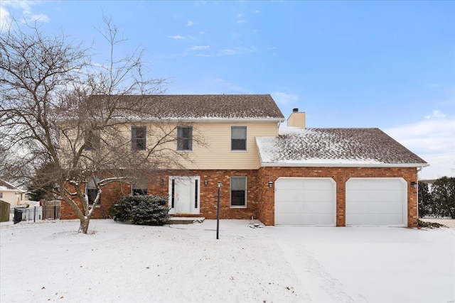 view of front of property with a garage