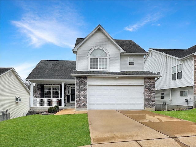 view of front property with a front yard, a garage, and a porch