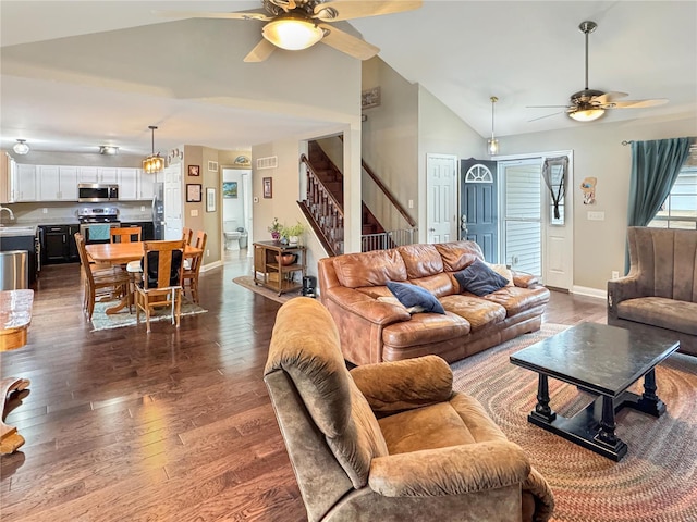 living room featuring high vaulted ceiling, dark hardwood / wood-style floors, and ceiling fan