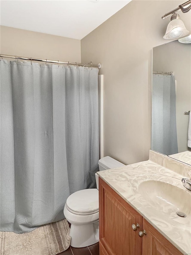 bathroom with toilet and vanity