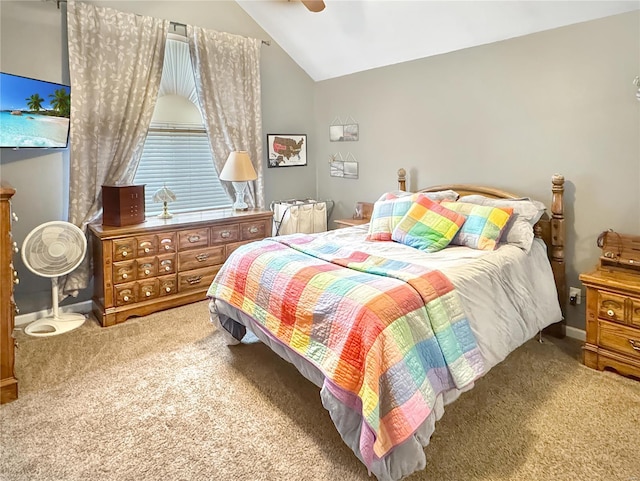 carpeted bedroom with vaulted ceiling and ceiling fan