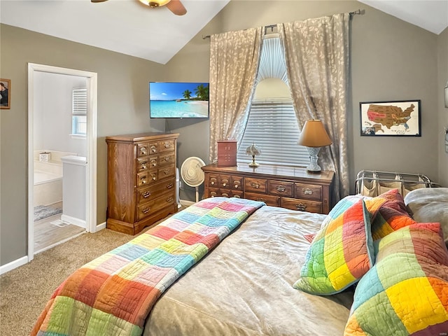 carpeted bedroom with lofted ceiling, connected bathroom, and ceiling fan