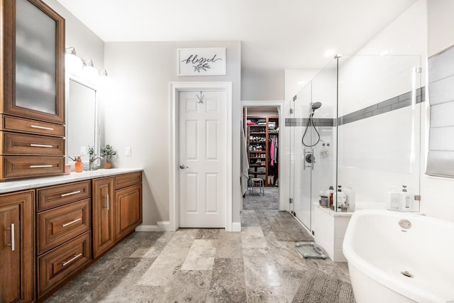 bathroom featuring vanity and plus walk in shower