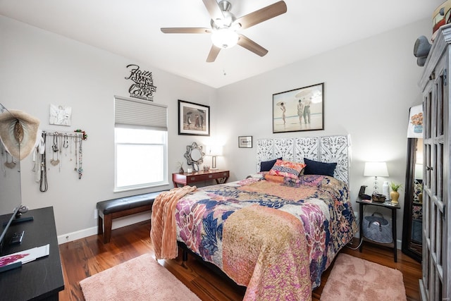 bedroom featuring ceiling fan and dark wood-type flooring