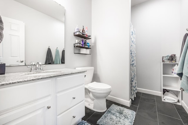 bathroom with tile patterned floors, toilet, and vanity