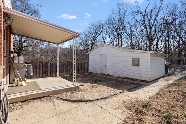 view of outbuilding with an outdoor structure and fence