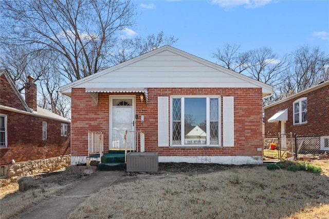 view of front of home featuring brick siding