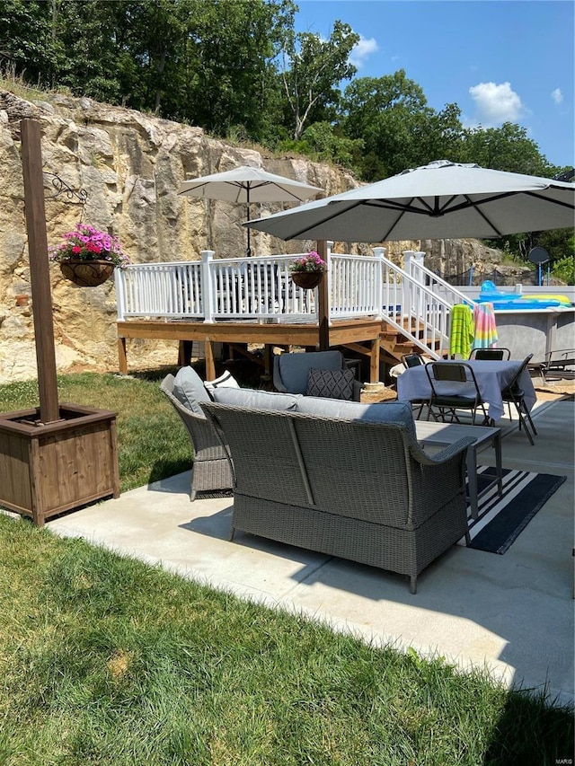 view of patio / terrace with a swimming pool side deck and an outdoor hangout area