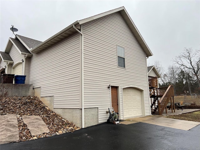 view of side of home with a garage