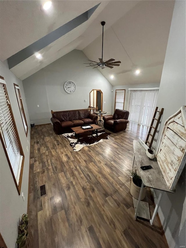 living room with high vaulted ceiling, ceiling fan, and dark hardwood / wood-style floors