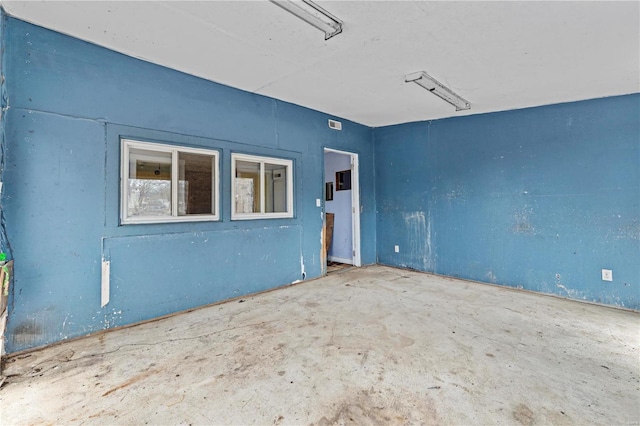 empty room with unfinished concrete floors