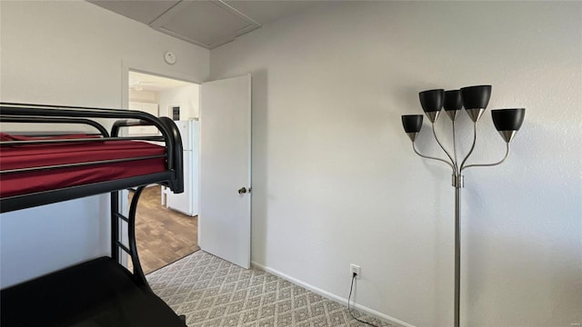 bedroom with wood finished floors and baseboards