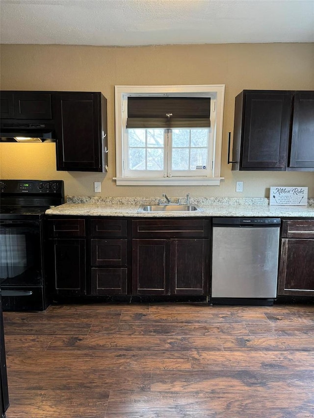 kitchen with dark wood finished floors, dark cabinets, stainless steel dishwasher, black electric range, and a sink