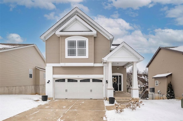 view of front of house featuring concrete driveway and an attached garage