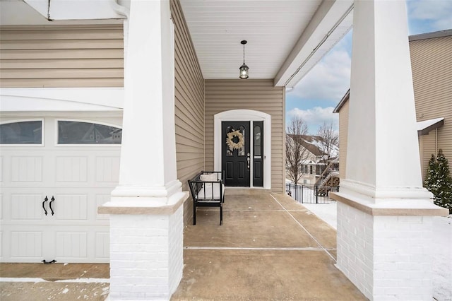 view of exterior entry with a garage