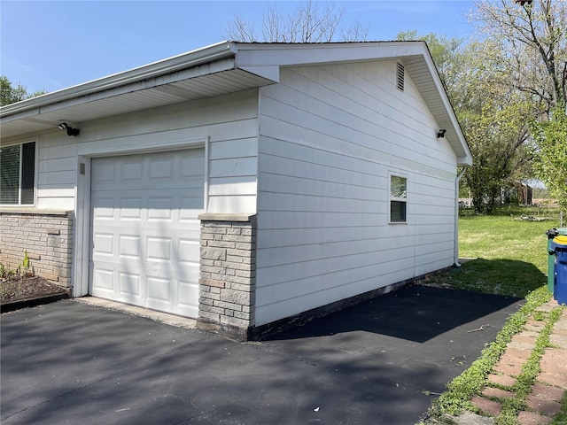 view of side of property with a garage